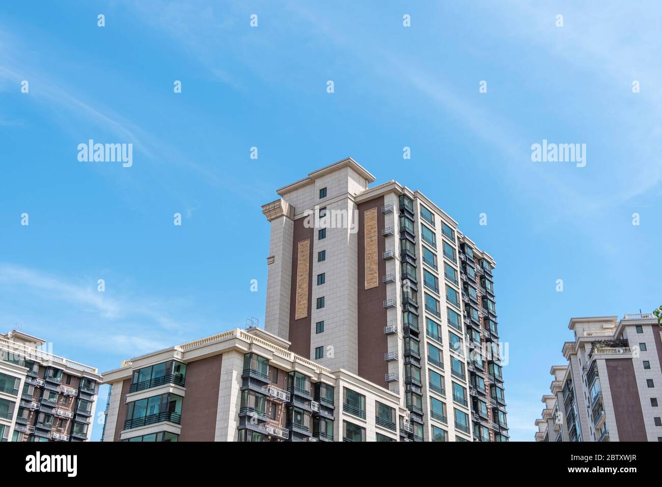 Residential area under blue sky and white clouds Stock Photo - Alamy
