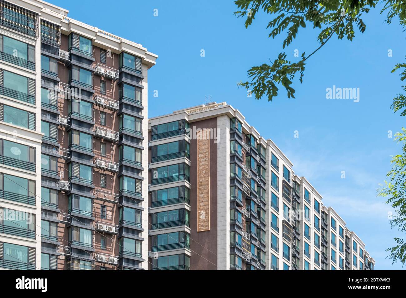 Residential area under blue sky and white clouds Stock Photo - Alamy