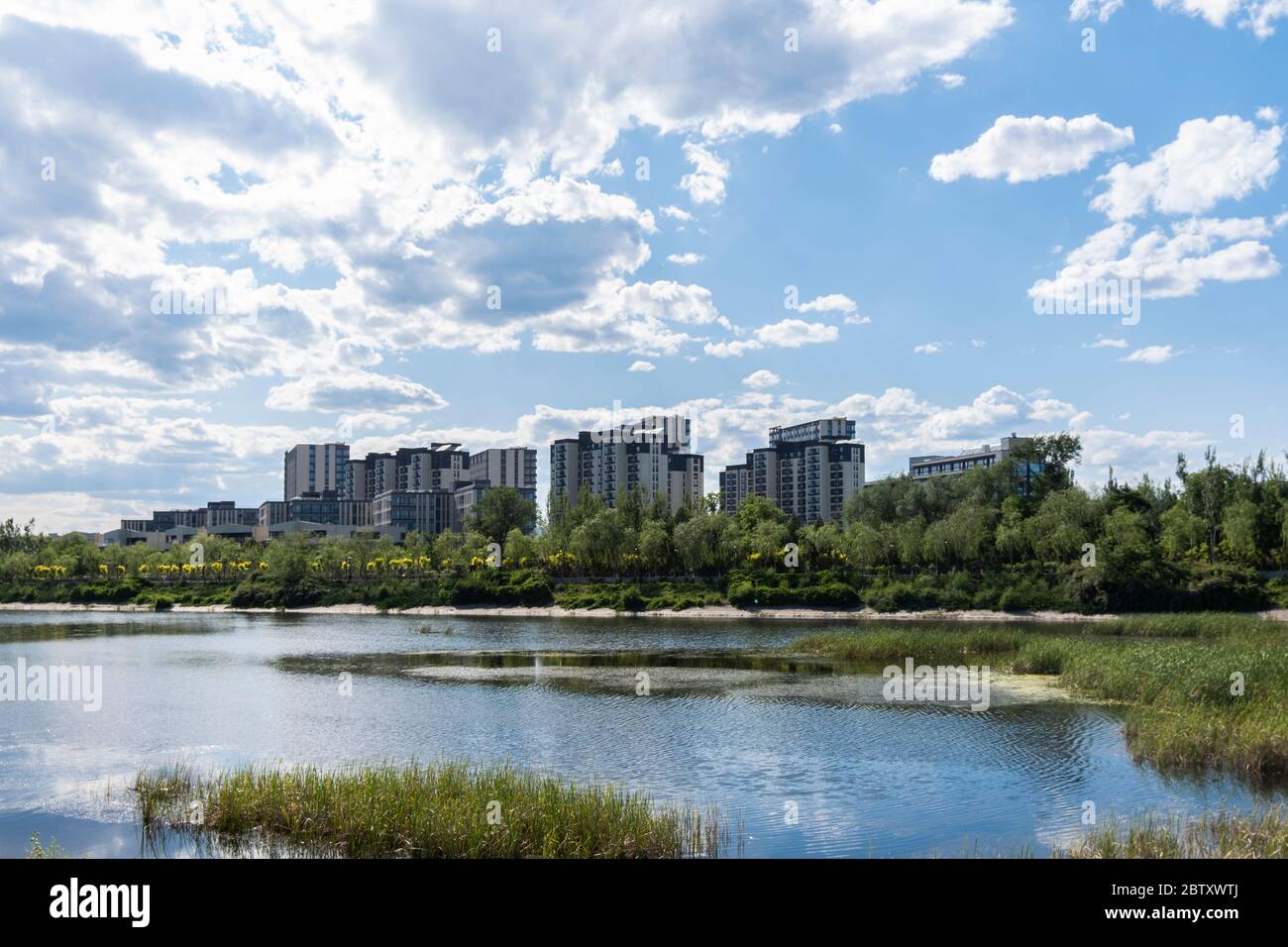 Residential area under blue sky and white clouds Stock Photo - Alamy