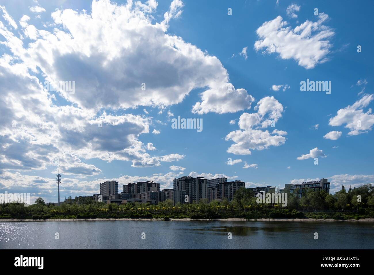 Residential area under blue sky and white clouds Stock Photo - Alamy