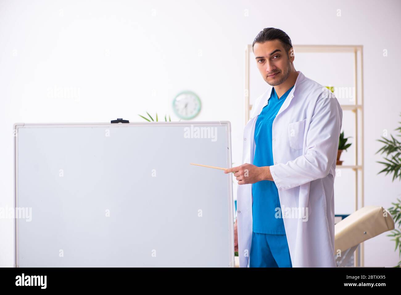 Presenting doctor pointing flip chart hi-res stock photography and ...