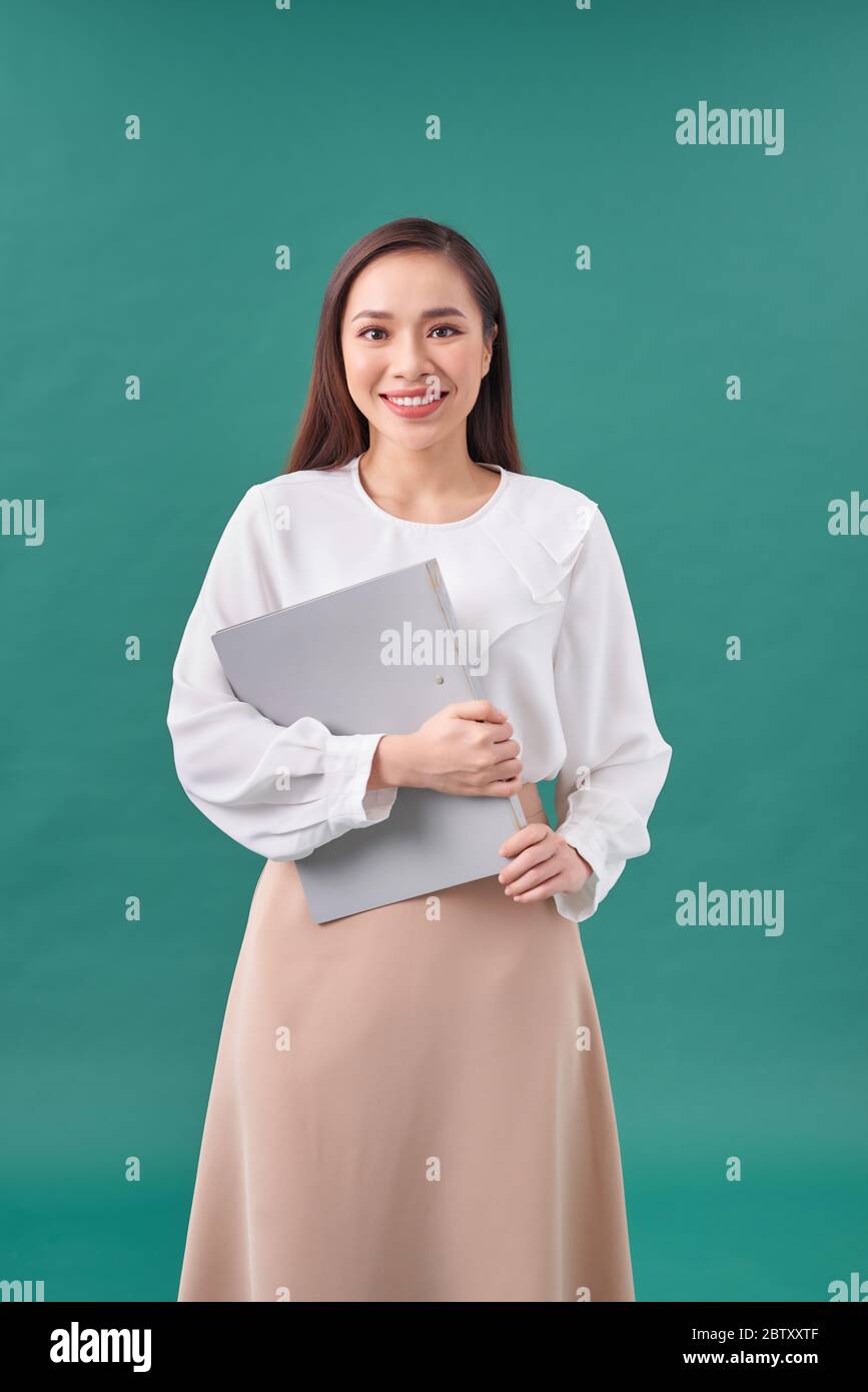 Happy successful business woman with gray folder Stock Photo - Alamy