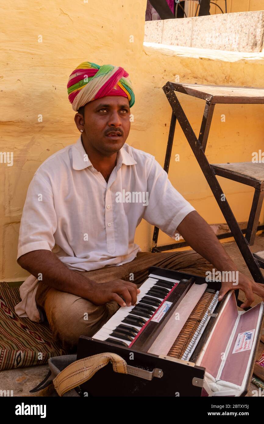 Indian male musician artist playing Harmonium at Jaisalmer Fort Stock Photo