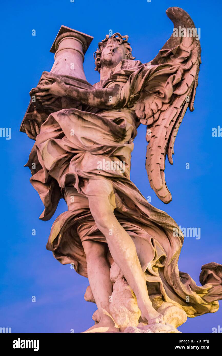 Statue of angel bearing a column at Ponte Sant Angelo in Rome, Italy. Sculpure was made by Antonio Raggi at 1669. Stock Photo
