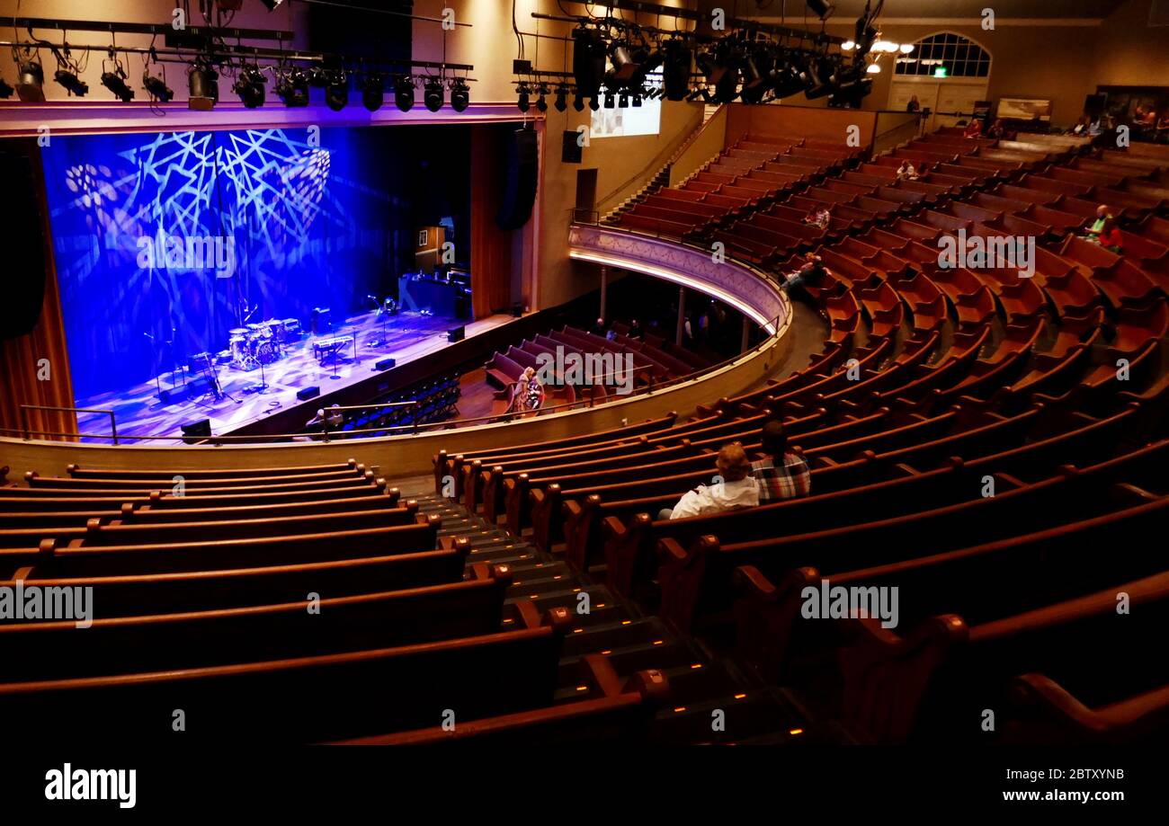 Seats and stage at the Ryman Auditorium former home of the Grand Ole Opry country music radio Nashville Tennessee USA Stock Photo