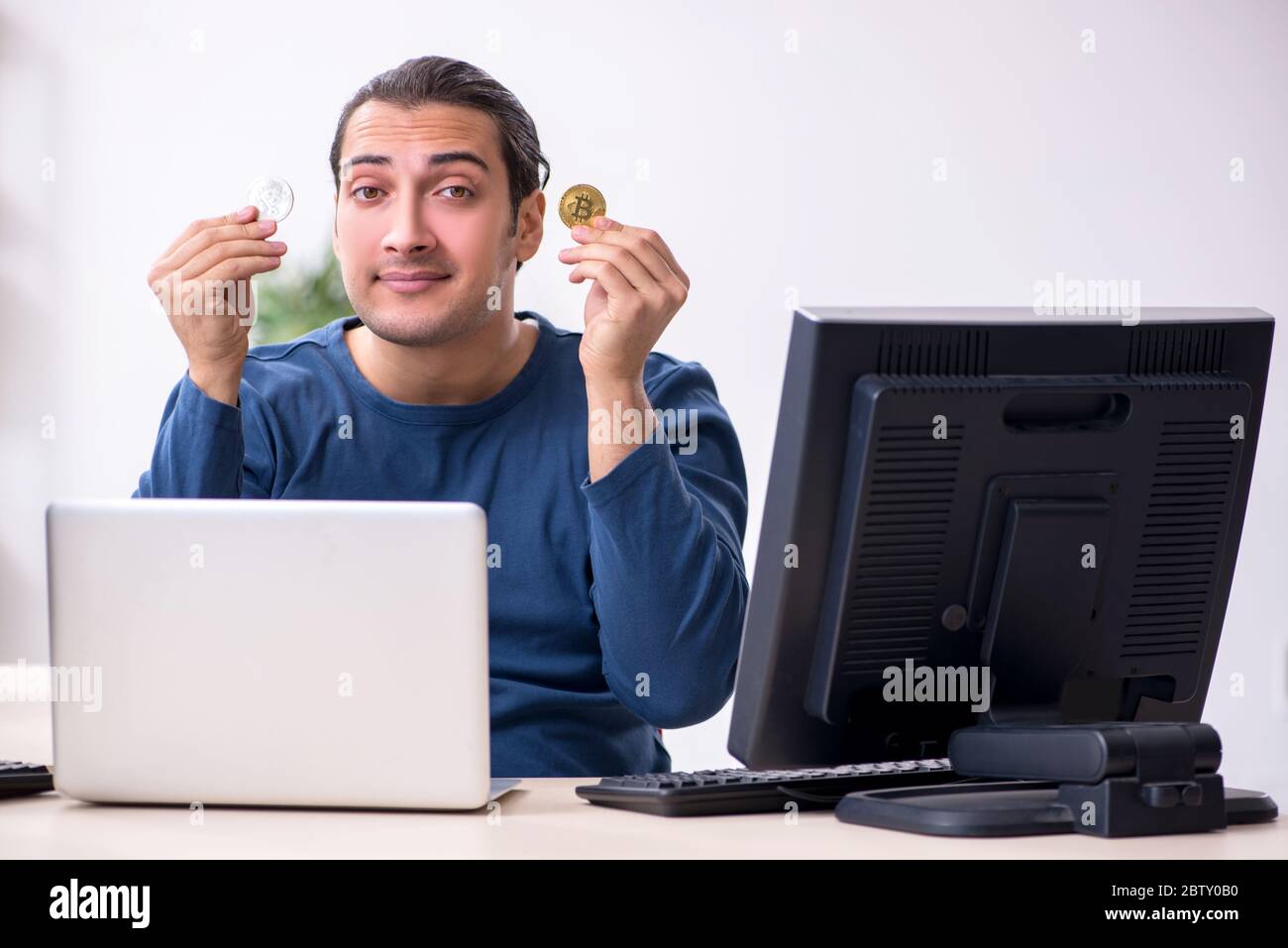 Young it specialist working in the office Stock Photo - Alamy