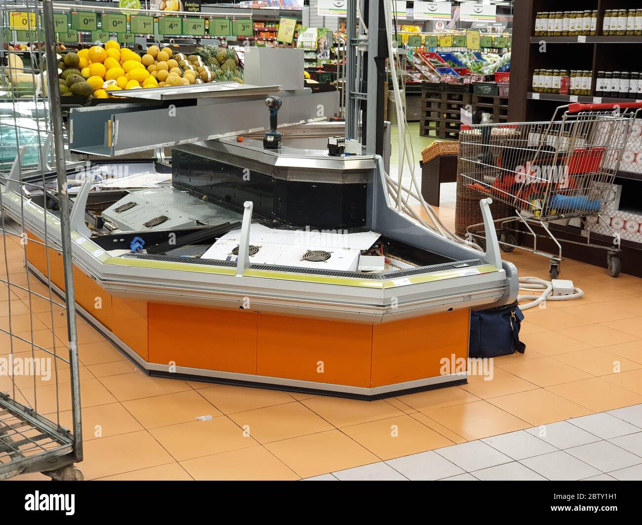 Open refrigeration is being fixed in super market Stock Photo