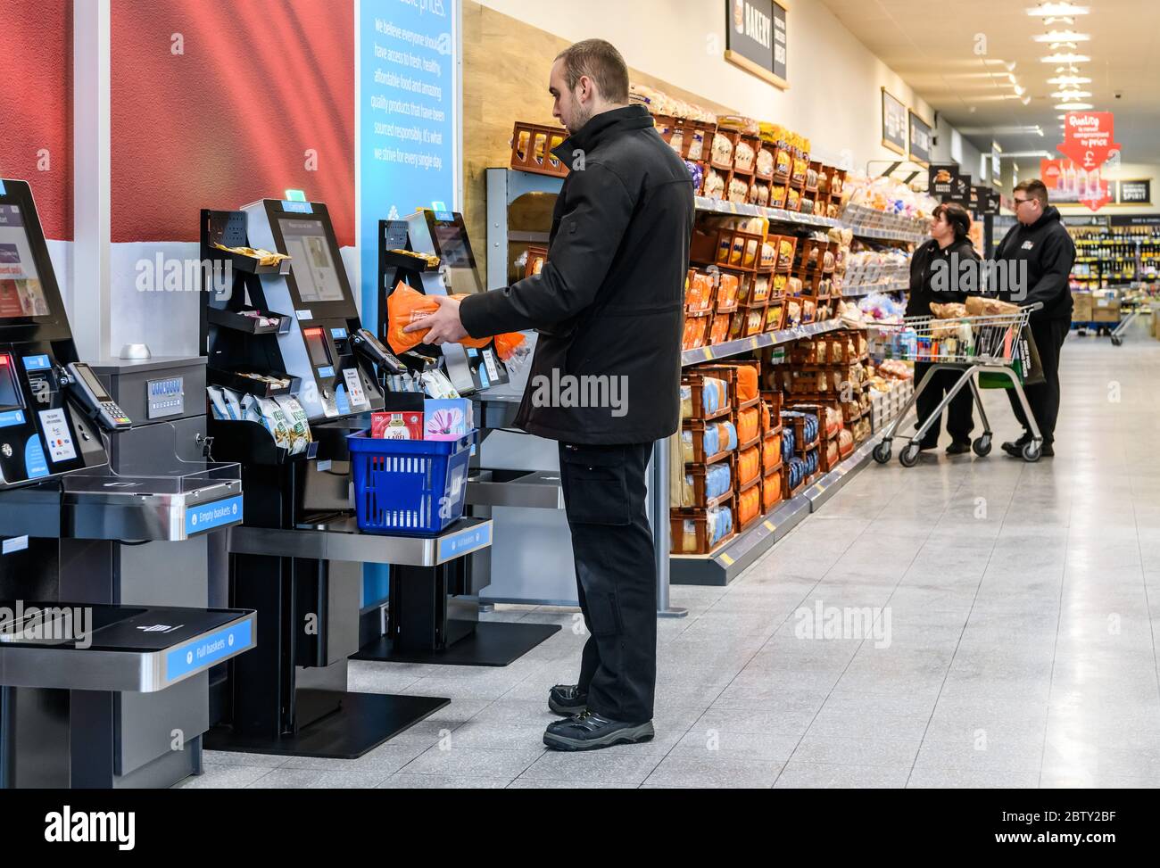 Self service checkouts in an Aldi supermarket store in Tamworth, Staffordshire, England, UK. Stock Photo