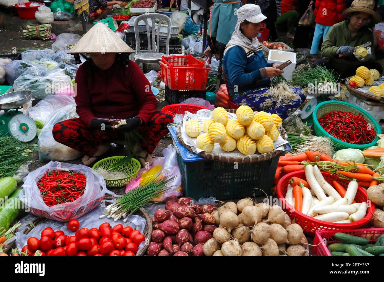 Woman selling fresh vegatables at market, Quy Nhon, Vietnam, Indochina, Southeast Asia, Asia Stock Photo