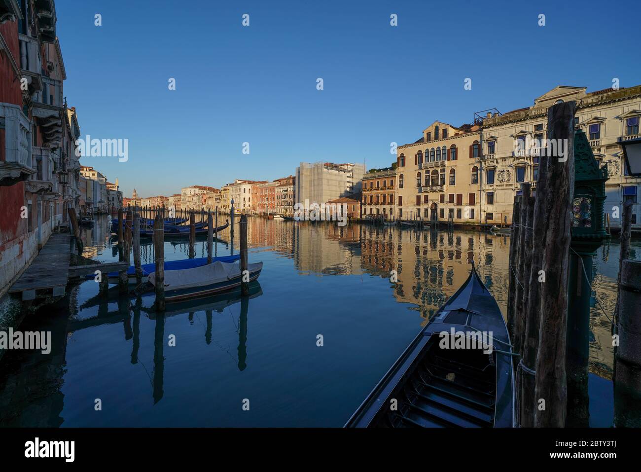 Reflections of the buildings in the calm water of the Grand Canal ...