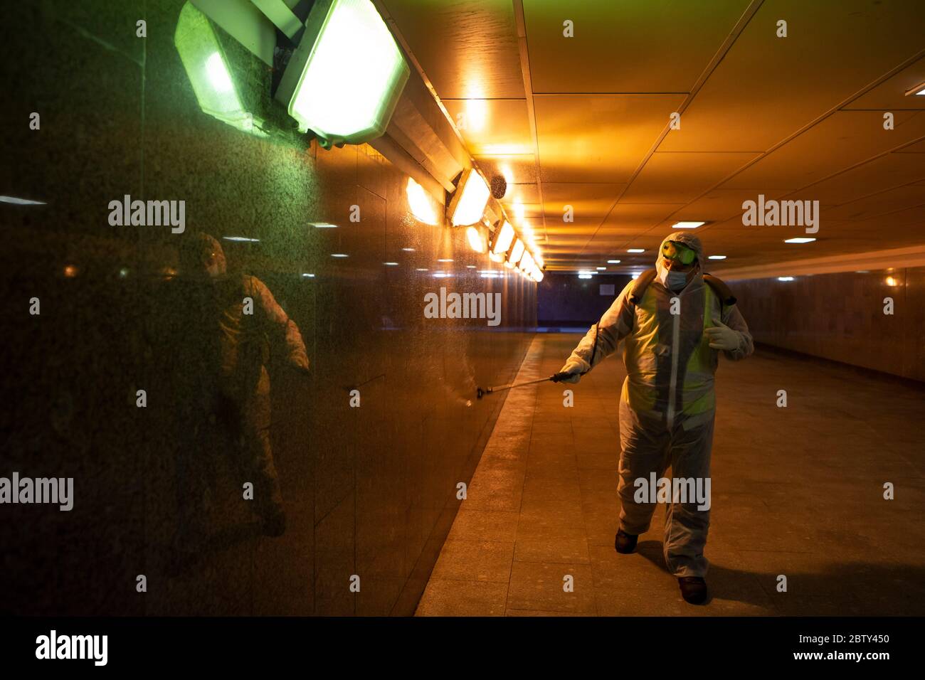 Moscow, Russia. 28th May, 2020. A municipal employee disinfects an underground pedestrian passage in Moscow, Russia, on May 28, 2020. Russia confirmed 8,371 new COVID-19 cases in the last 24 hours, raising its total number of infections to 379,051, its coronavirus response center said in a statement Thursday. Credit: Alexander Zemlianichenko Jr/Xinhua/Alamy Live News Stock Photo