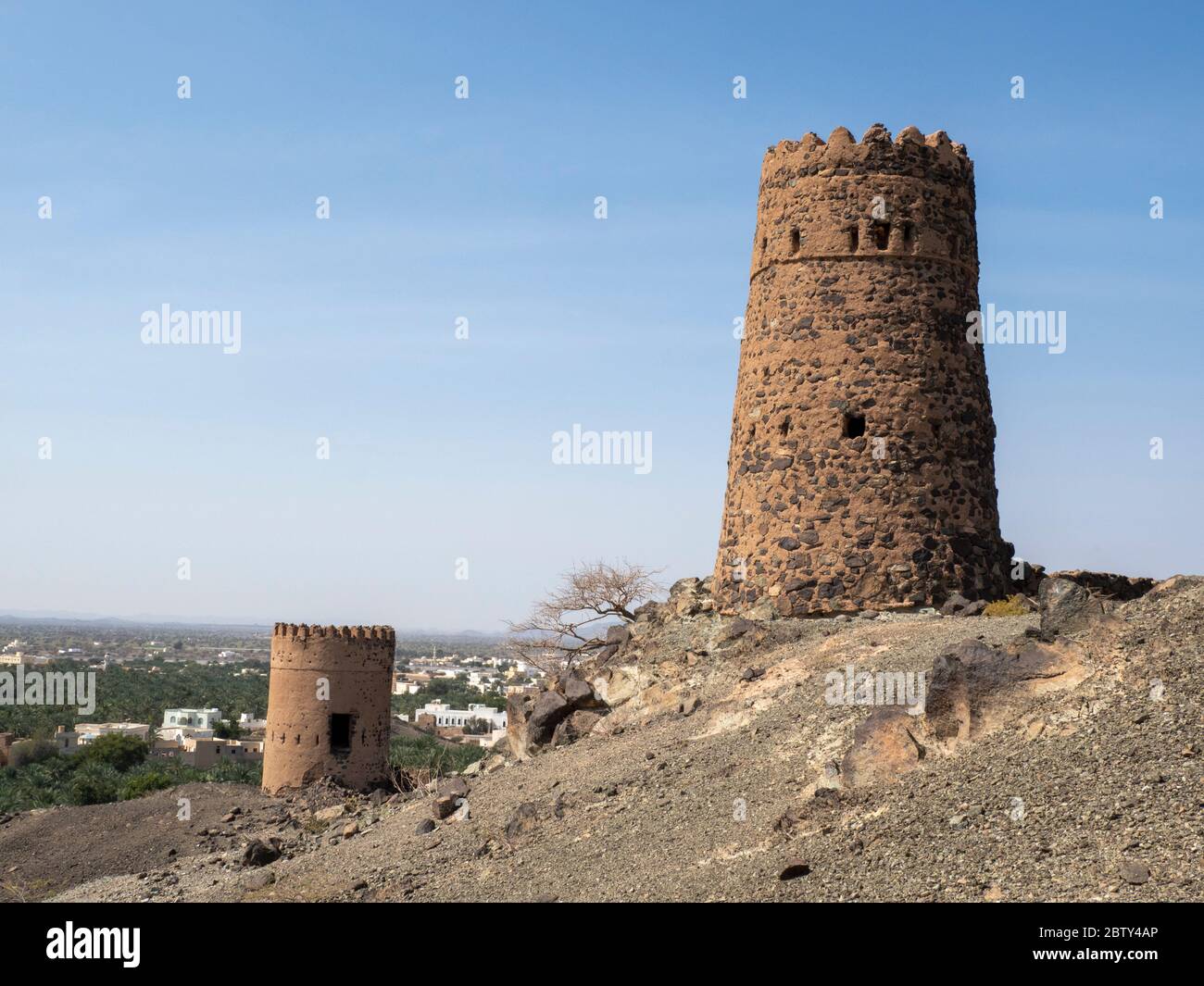 Remains of the mud and clay watch towers in the village of Mudayrib, Sultanate of Oman, Middle East Stock Photo