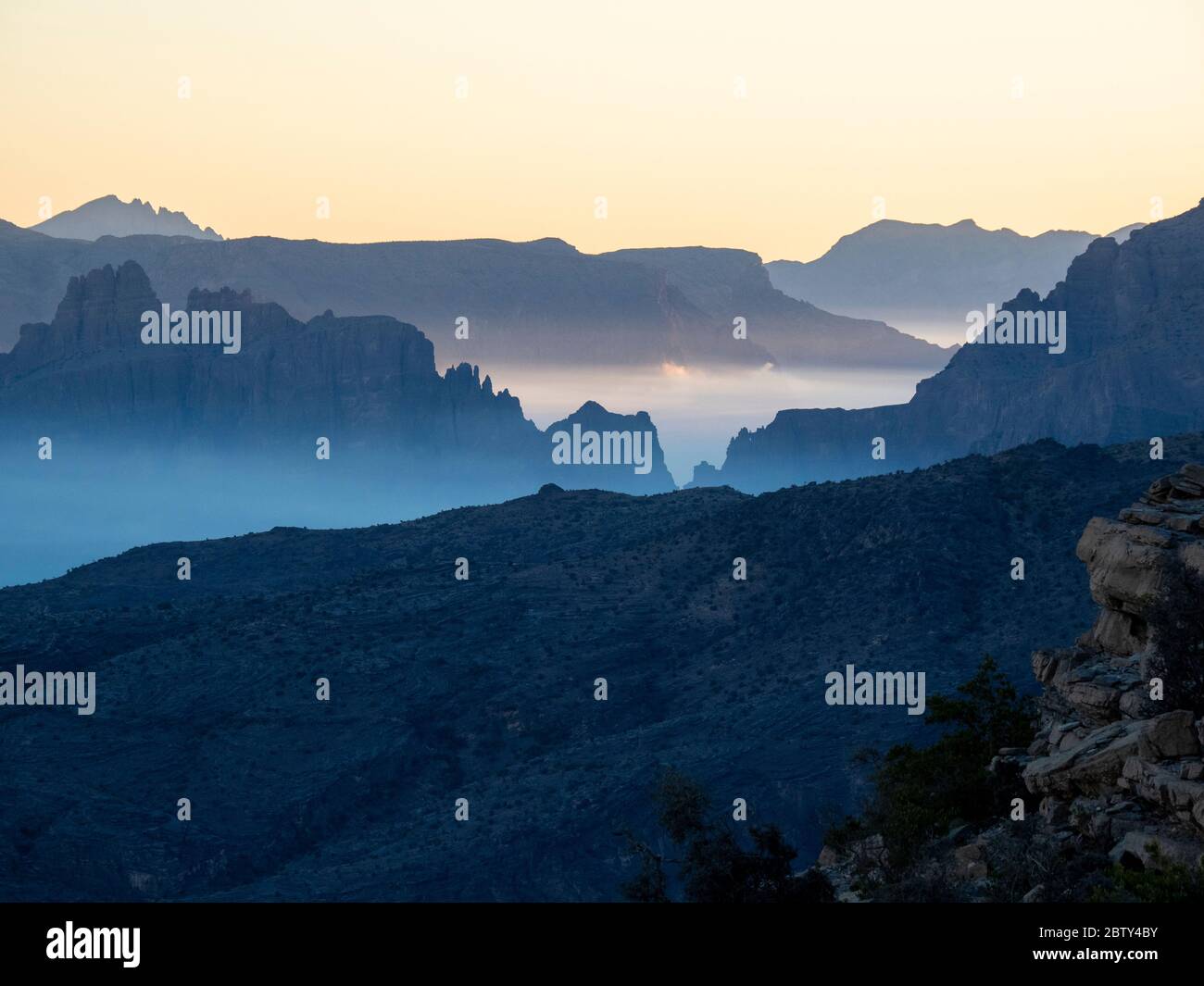 Low-lying clouds fill the valley at sunrise at Sharaf Al Alamayn, Sultanate of Oman, Middle East Stock Photo
