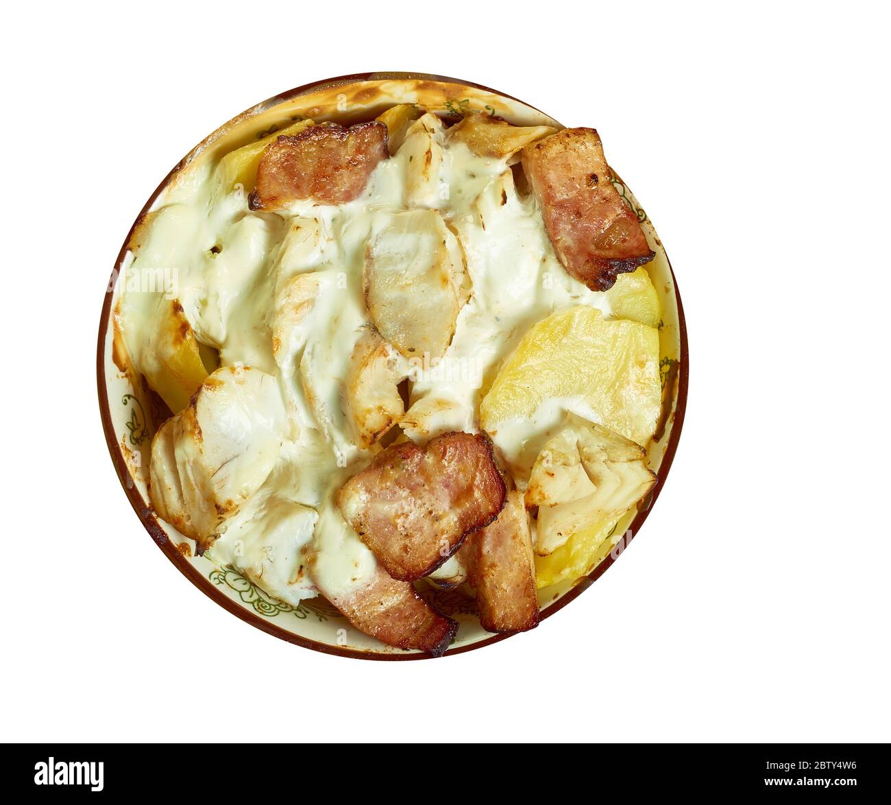 Smoked haddock savoy cabbage,bacon and creamy potato gratin Stock Photo