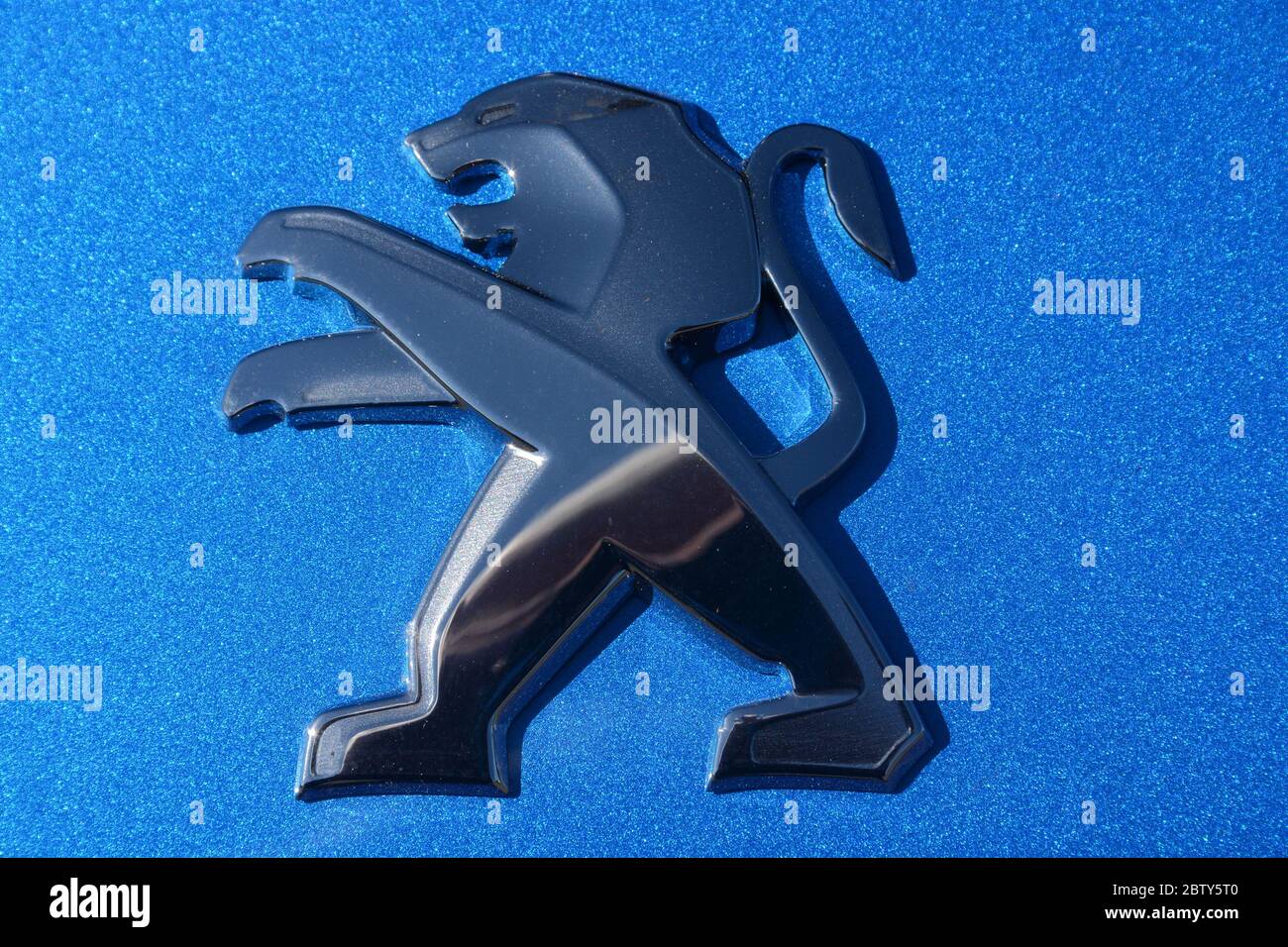 Peugeot car logo, lion Stock Photo Alamy