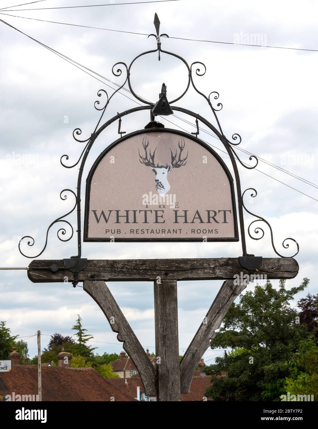 Traditional Hanging Pub sign at The White Hart Inn, The Street, South Harting, West Sussex, England, UK Stock Photo