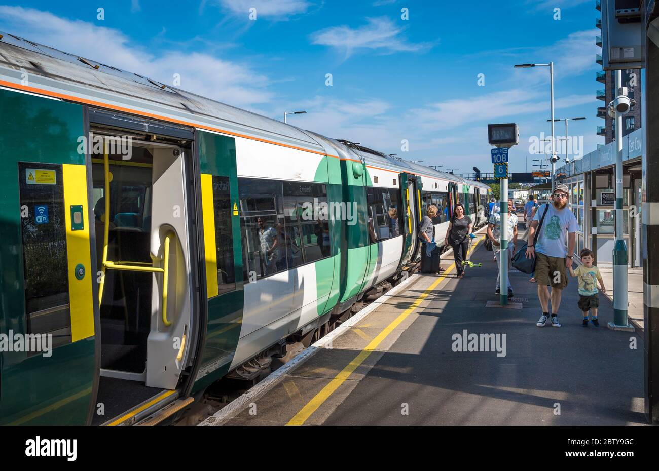 Passengers getting off a train at East Croydon railway station, England. Stock Photo