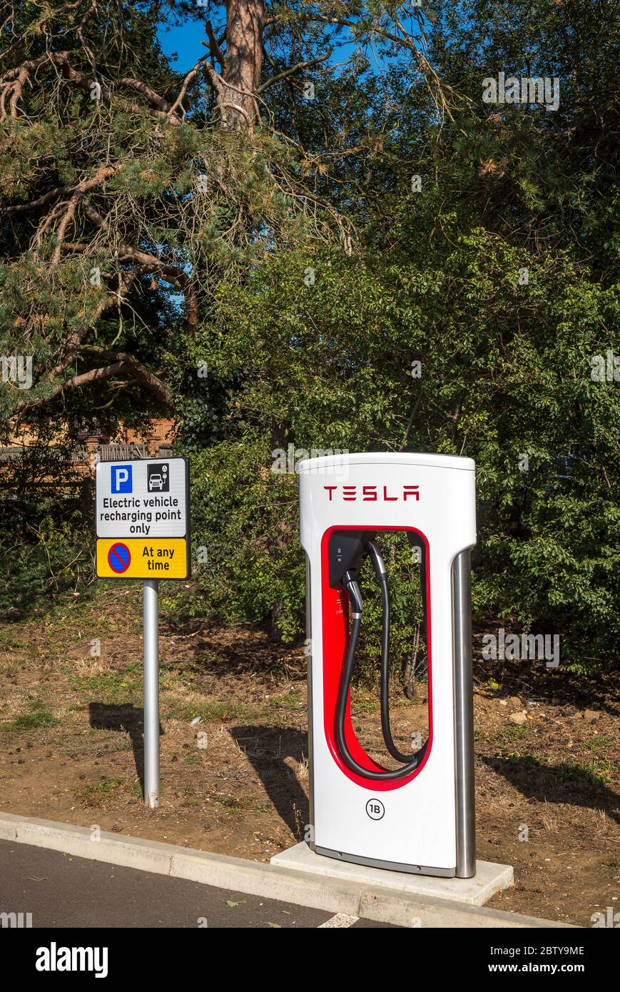 Electric vehicle charging points in a car park in England Stock Photo