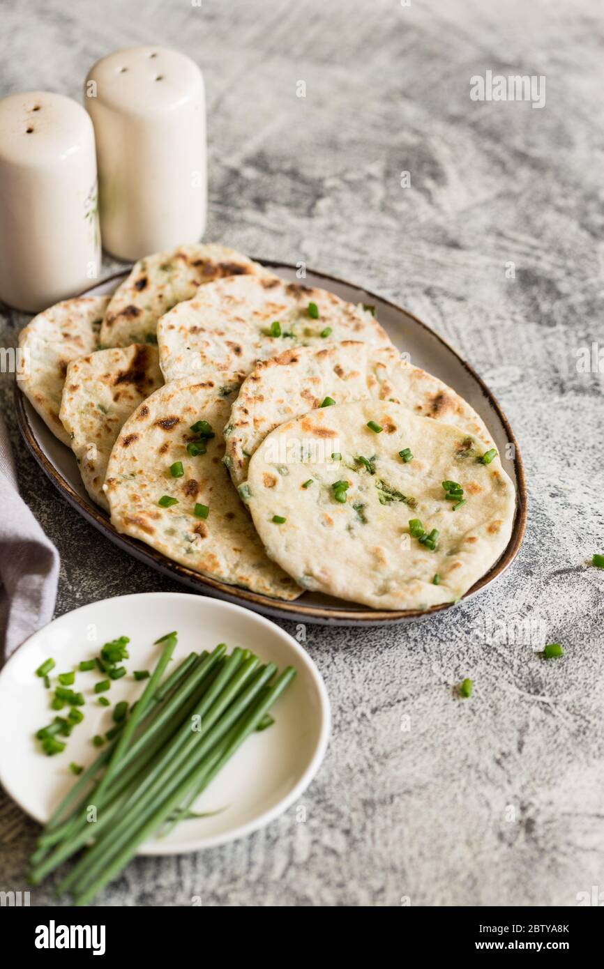 Onion naan traditional indian bread. pita bread or scones with green onions Stock Photo Alamy