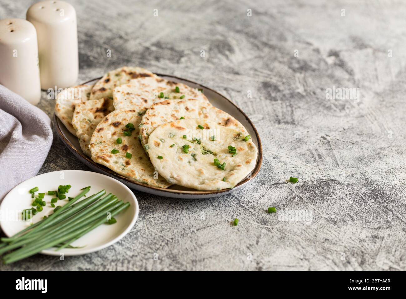Onion naan traditional indian bread. pita bread or scones with green