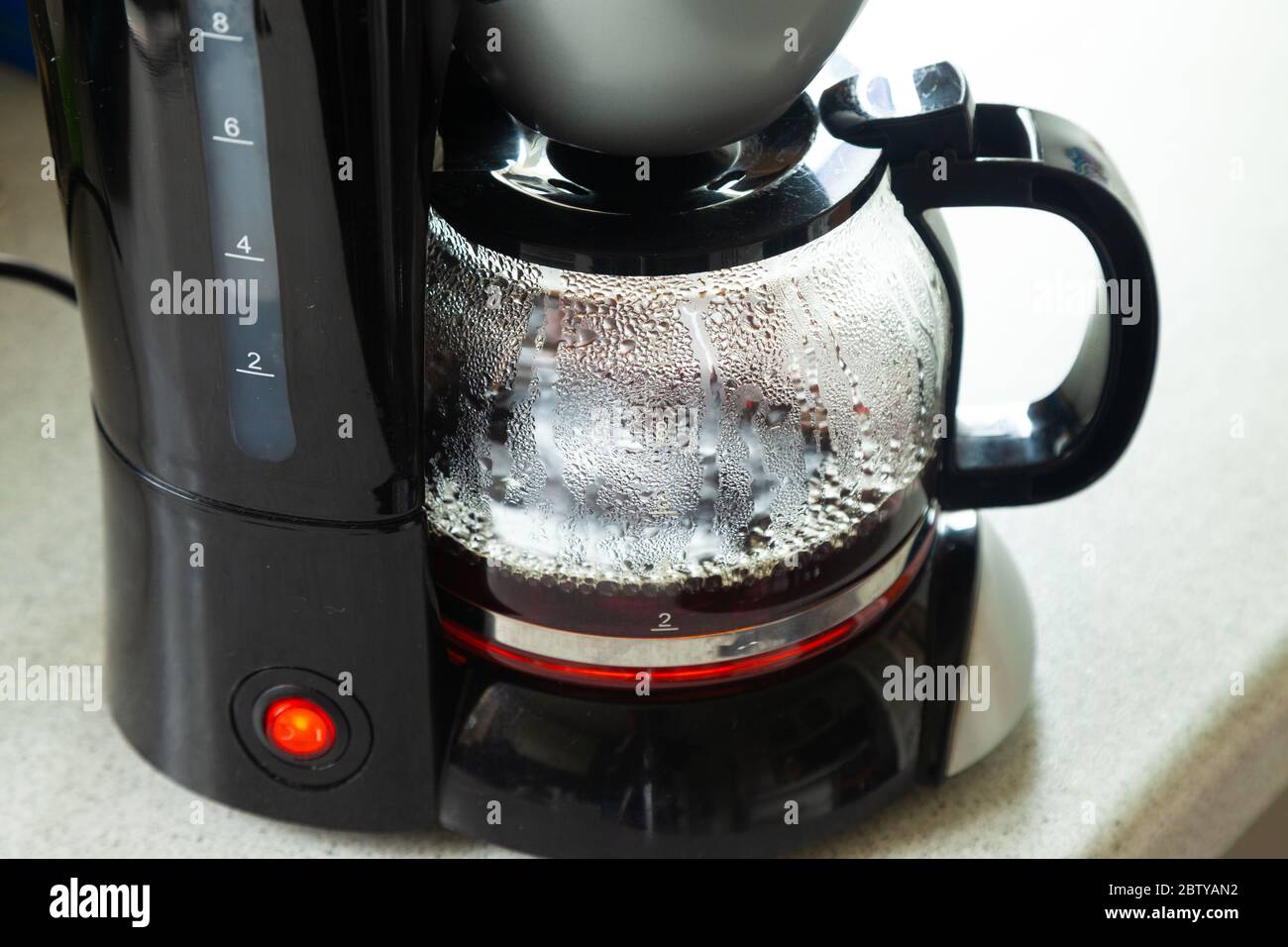Close-Up of a plastic coffee maker making a fresh brew. Stock Photo