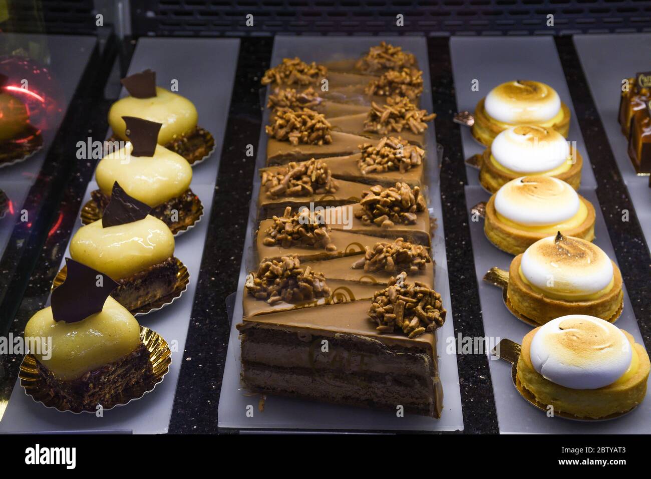 Various types of cakes, tart, mousse, pies for sale in bakery or pastry