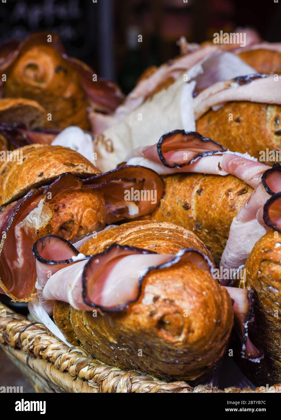 Prosciutto, ham and cheese and bacon sandwiches canapes during hotel brunch buffet outside