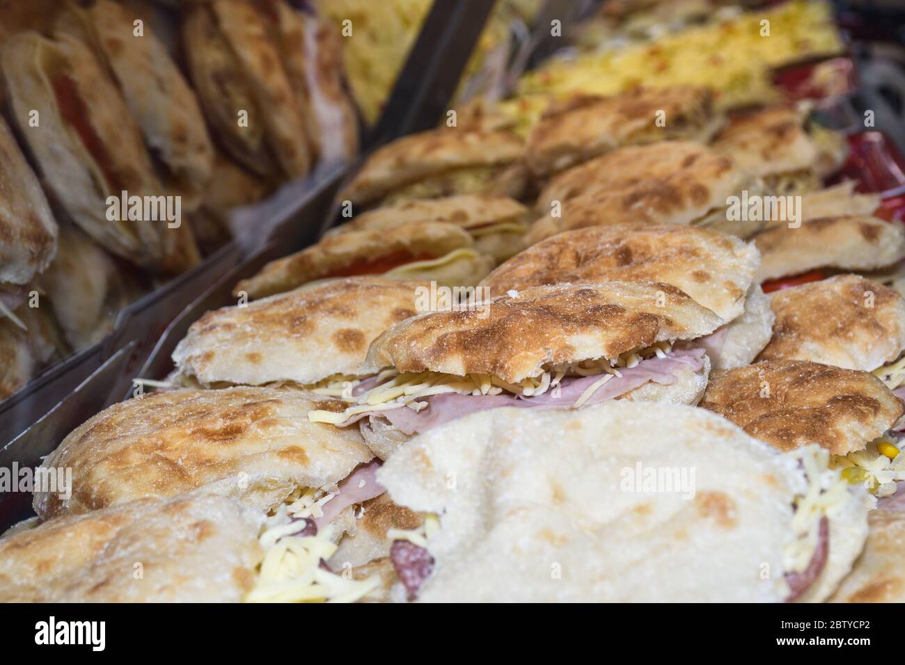 Assortment of different sandwiches for sale on counter top display