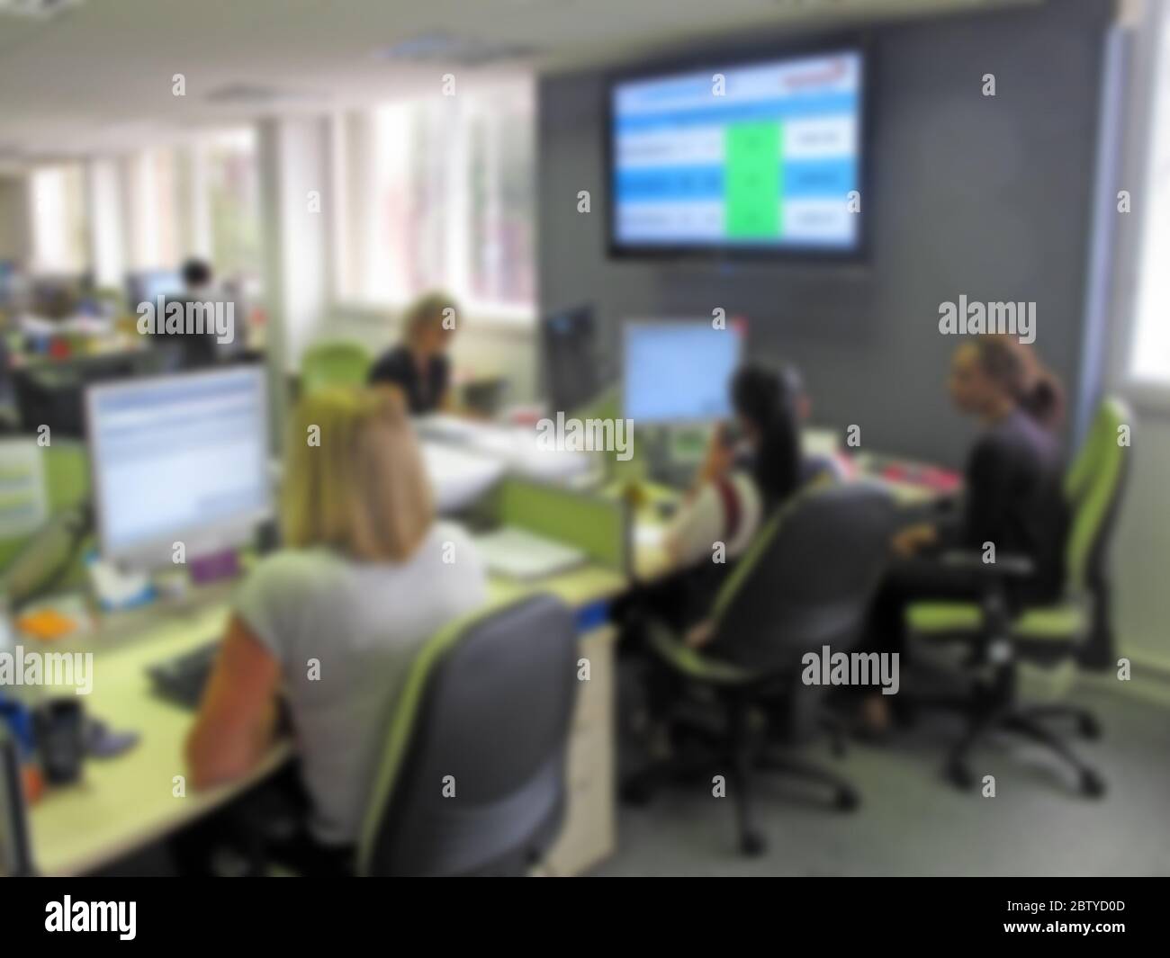 Out of focus call centre, customer service centre image, ladies Stock Photo