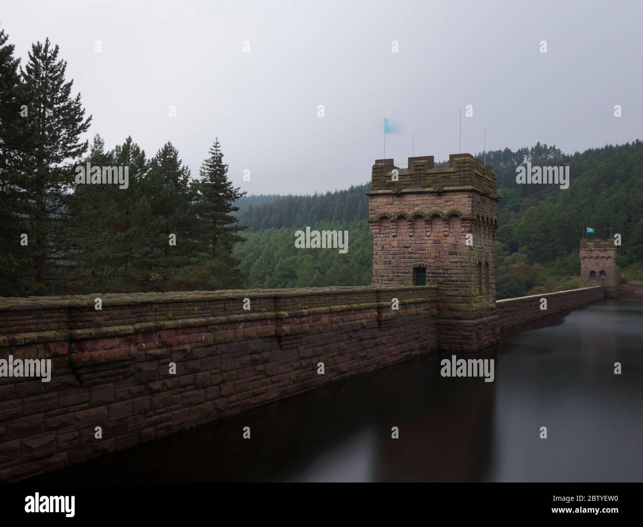 A long exposure of the Derwent Dam, it's towers and reservoir, Peak District National Park Stock Photo