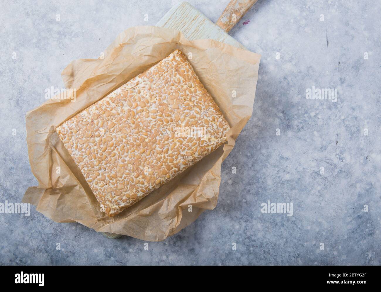 Slice of tempeh or tempe made of fermentation process that binds
