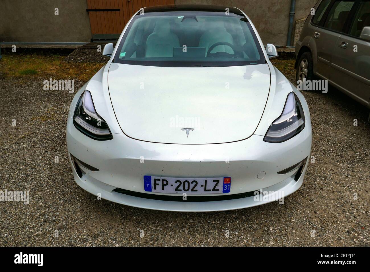 Tesla Model 3 Electric car in the Ariege, French Pyrenees, Pyrenees, France Stock Photo