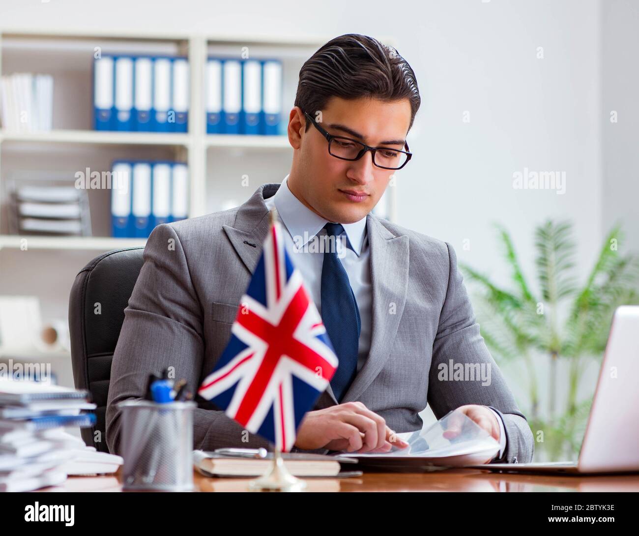 The businessman with british flag in the office Stock Photo - Alamy