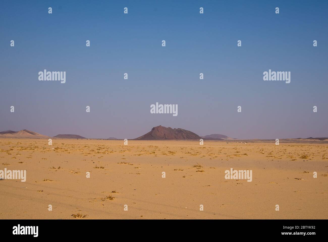 Mountain in the desert and the blue sky Stock Photo - Alamy