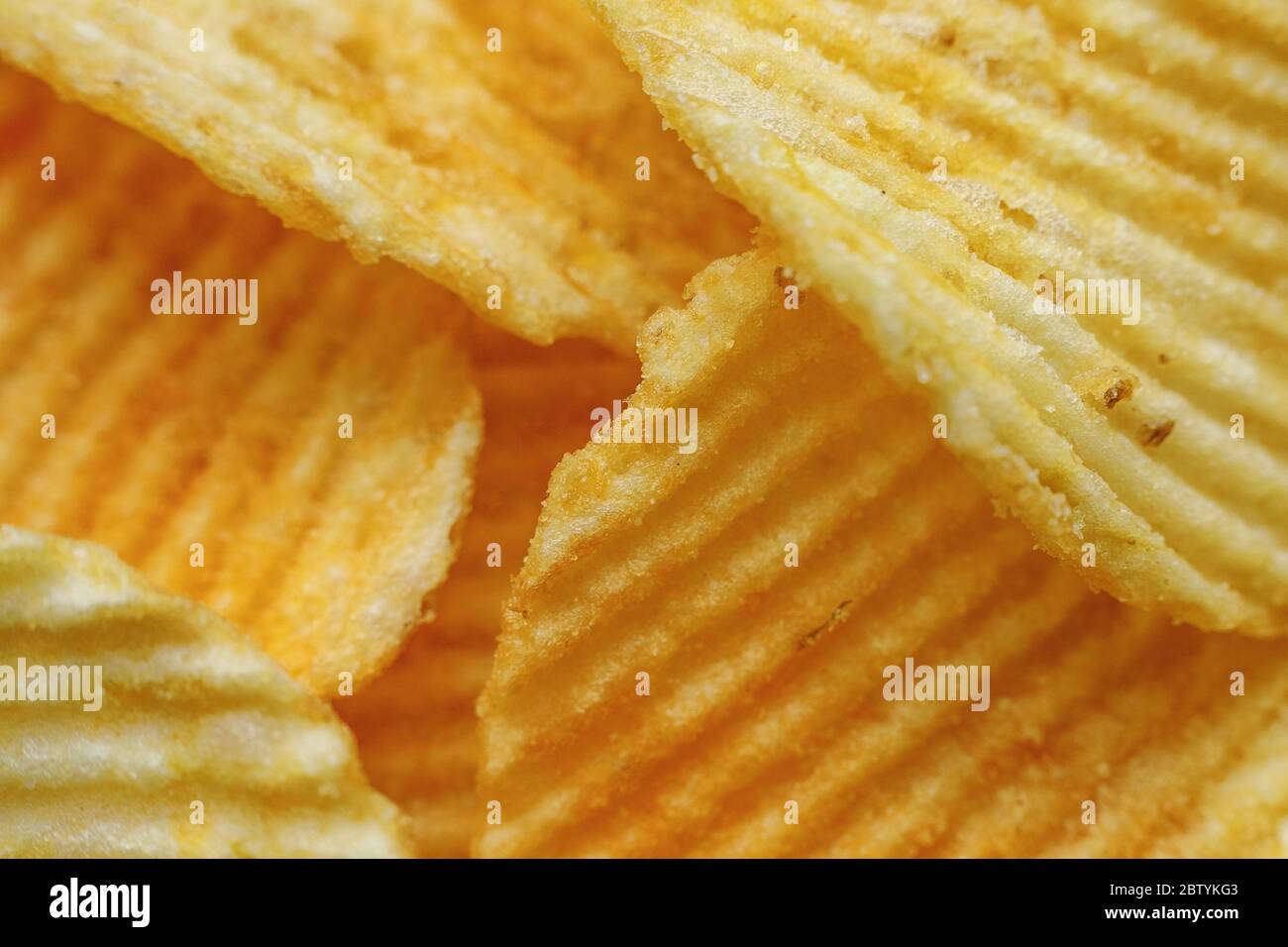Corrugated Potato Chips. Close-up macro view. Stock Photo