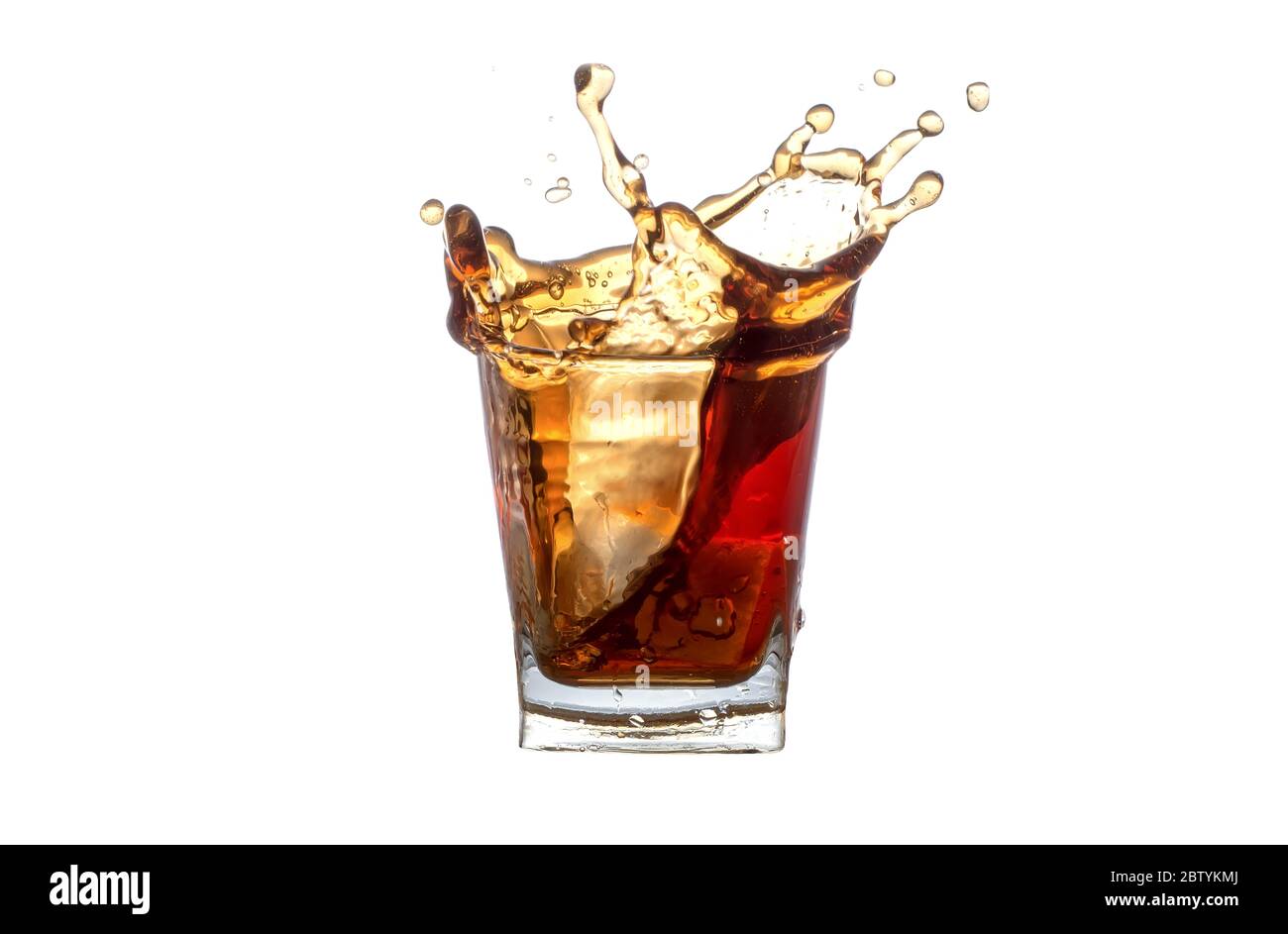 Splash pop soda in glass close-up isolated on a white background. Splashing  in a glass with soda from falling ice cubes isolated on a white background  Stock Photo - Alamy