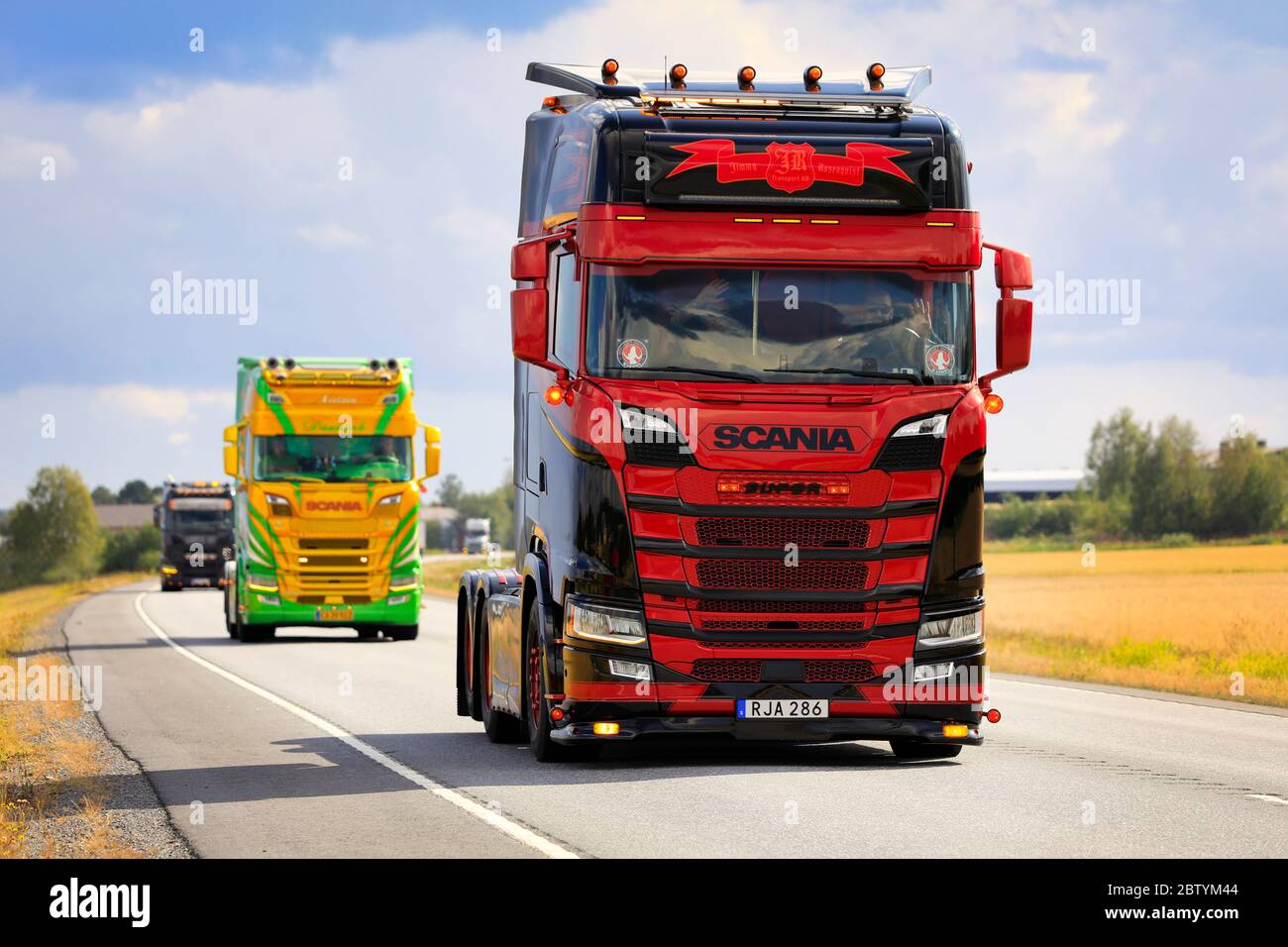 Customised Scania truck Jimmy Rosenqvist Transport AB with more Scania trucks in convoy to Power Truck Show 2019. Luopajarvi, Finland. Aug 8, 2019. Stock Photo