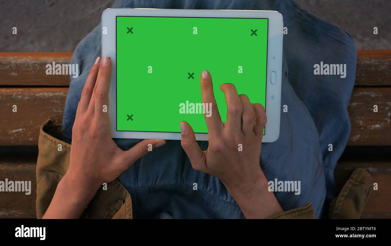 Woman's hands working on a tablet pc. Stock Photo