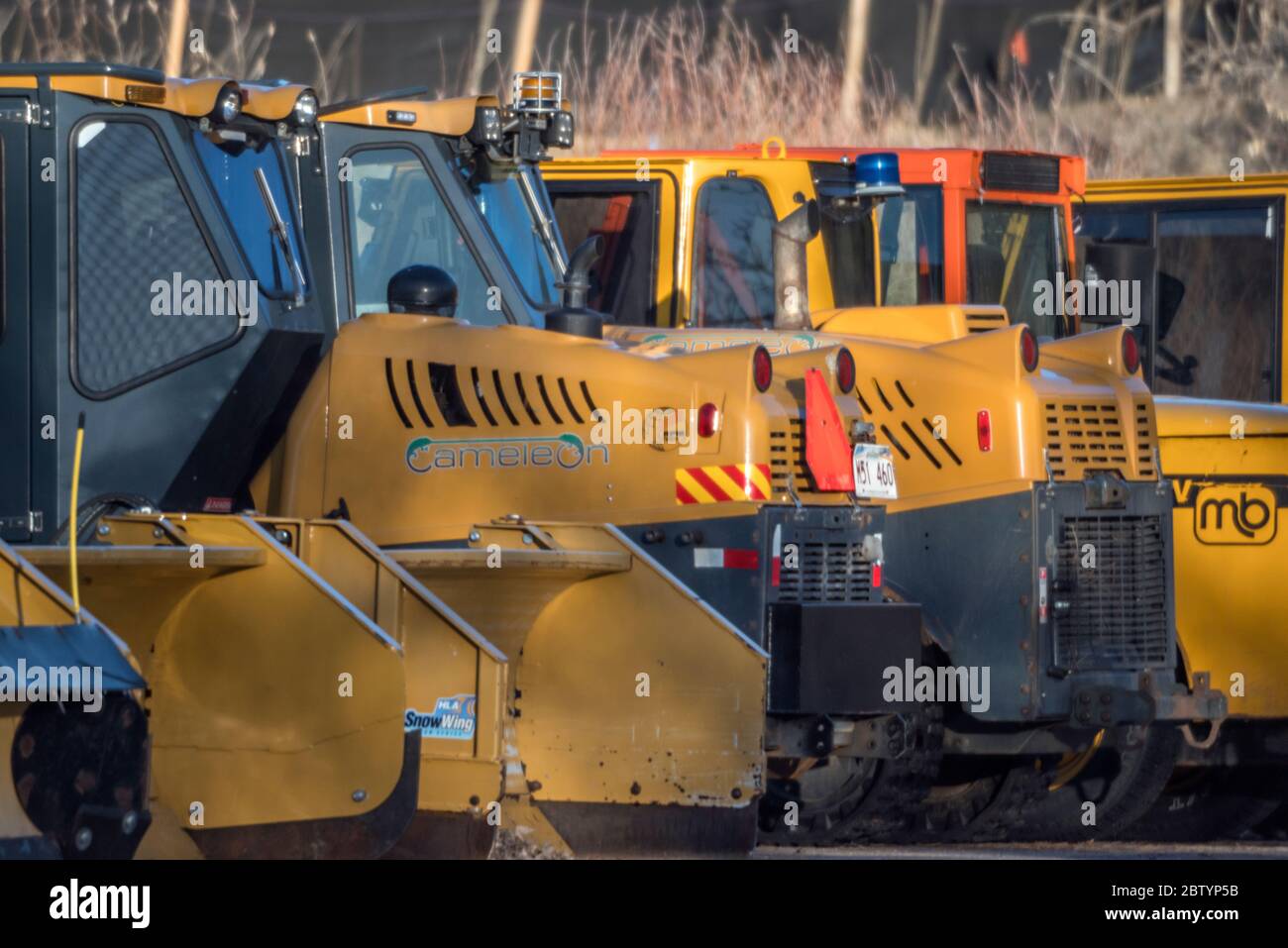 Heavy Snow Plow Equipment Lined up Before Winter in Colorado Stock Photo