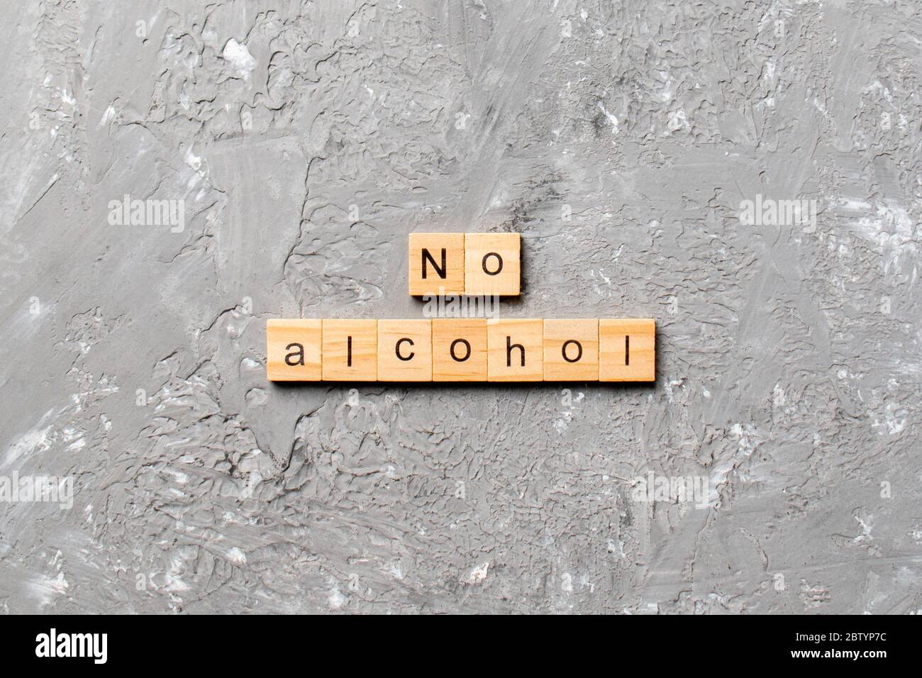no-alcohol-word-written-on-wood-block-no-alcohol-text-on-cement-table