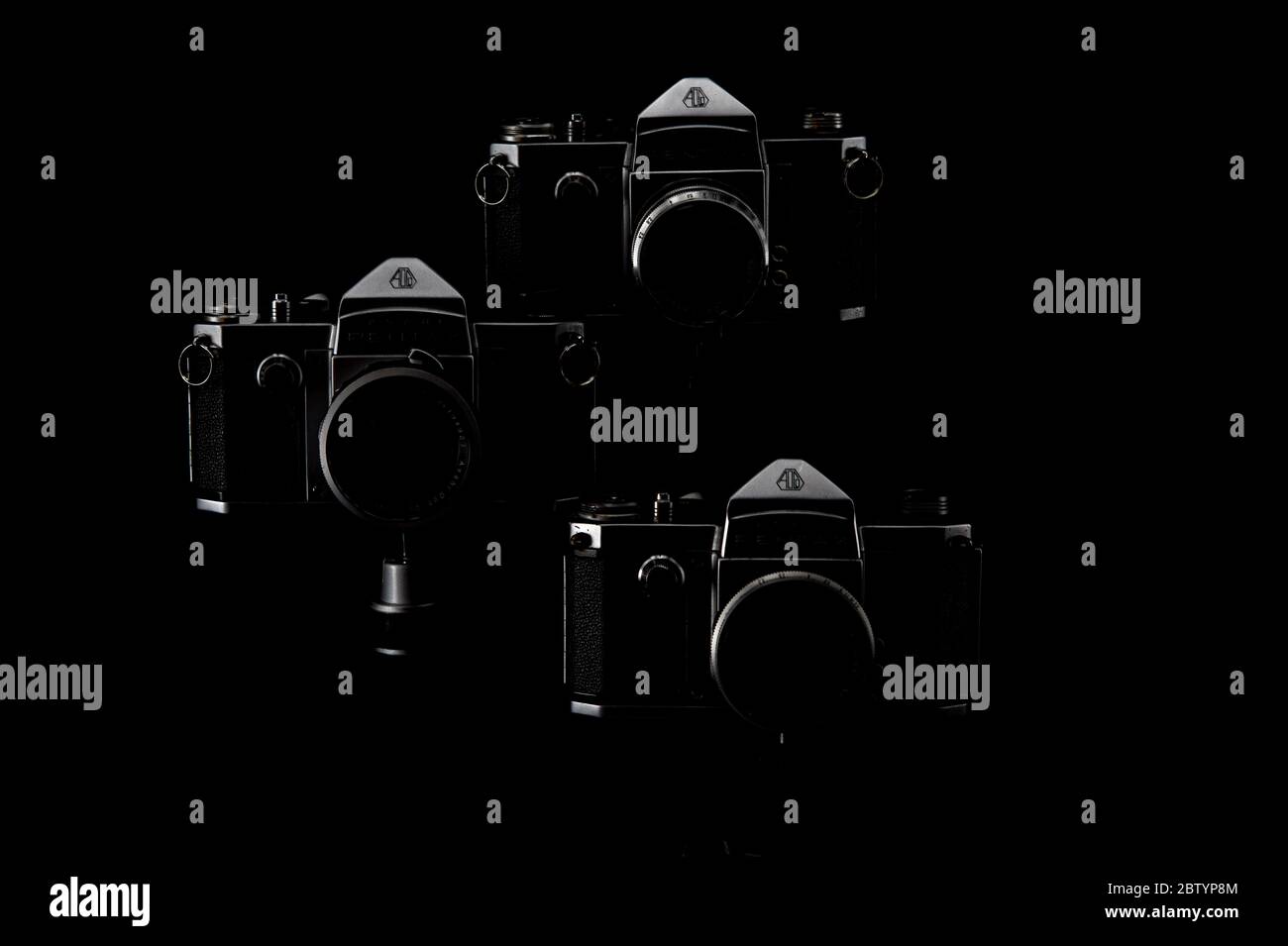 Vintage 1950s 35mm Pentax Film SLR on a Black Background Melting into Shadows Stock Photo