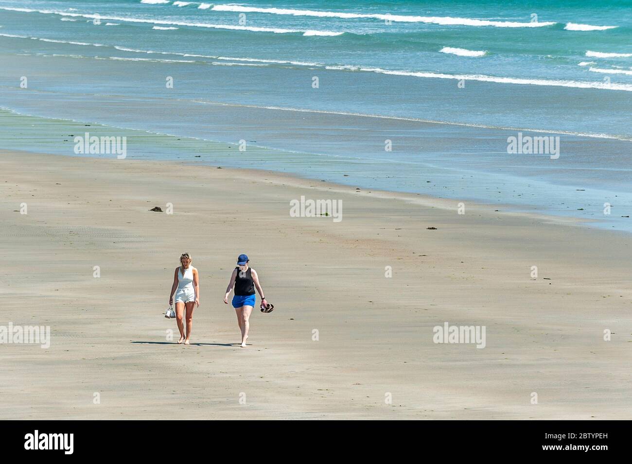 Inchydoney, West Cork, Ireland. 28th May, 2020.  People flocked to Inchydoney Beach today on a day of warm sunshine and high winds.  The weather is expected to get warmer over the Bank Holiday Weekend, with temperatures expected to reach the high 20's on Monday. Credit: AG News/Alamy Live News Stock Photo