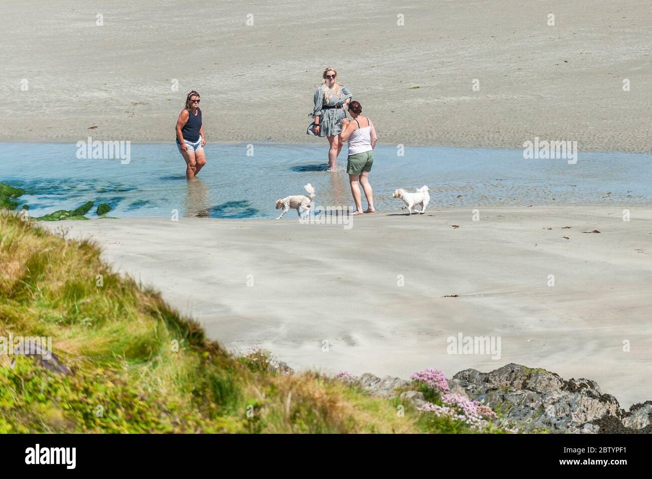 Inchydoney, West Cork, Ireland. 28th May, 2020.  People flocked to Inchydoney Beach today on a day of warm sunshine and high winds.  The weather is expected to get warmer over the Bank Holiday Weekend, with temperatures expected to reach the high 20's on Monday. Credit: AG News/Alamy Live News Stock Photo