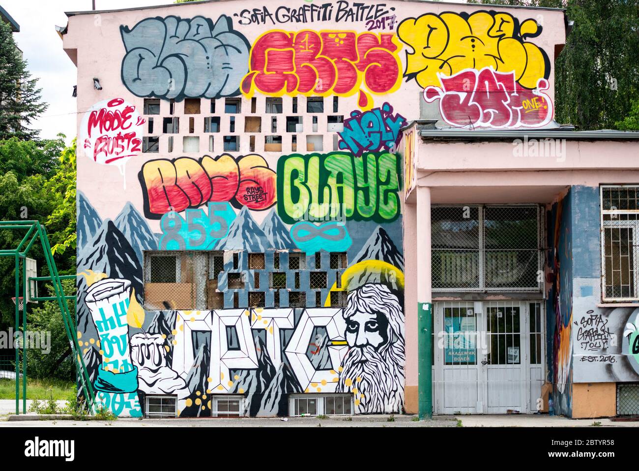 Graffiti street art and Sofia Graffiti Battle 2017 text on school facade wall in Sofia, Bulgaria, Eastern Europe, Balkans, EU Stock Photo