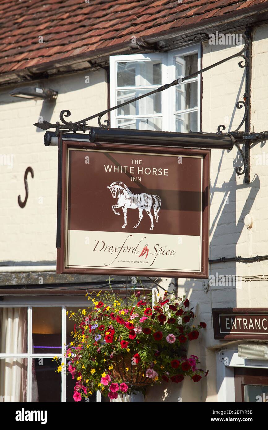 The White Horse Inn pub sign, Droxford, Hampshire, England, UK Stock Photo