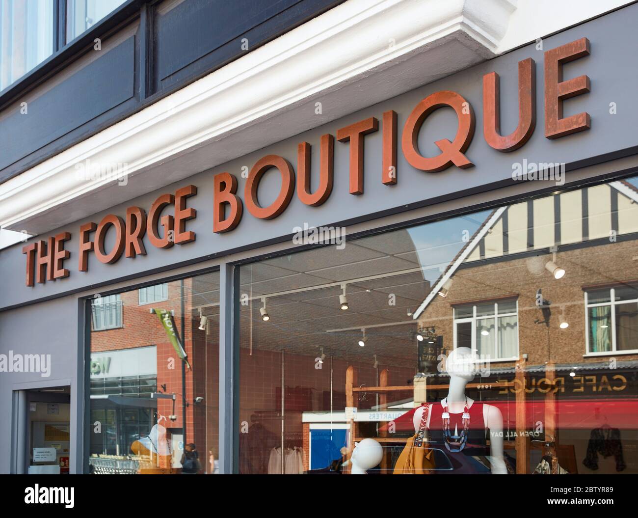 The Forge Boutique shop signage, Gerrards Cross, Buckinghamshire, England, UK Stock Photo