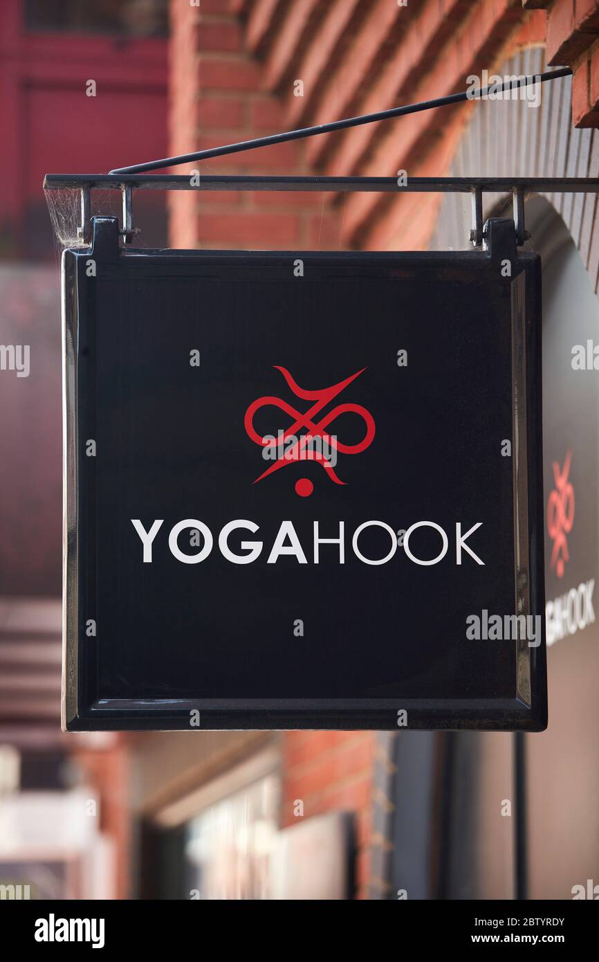 Yoga Hook hanging sign, Gerrards Cross, Buckinghamshire, England, UK Stock Photo