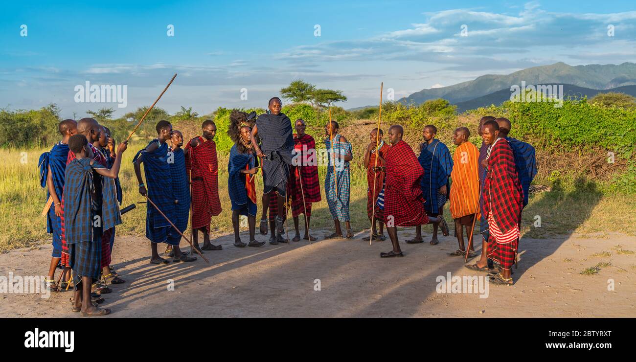 NGORONGORO, TANZANIA - February 15, 2020: Group of masai people participating a traditional dance with high jumps, selected focus Stock Photo