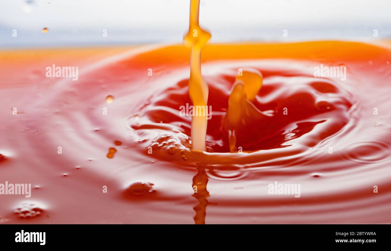 rippling after a few drops of grapefruit juice. Stock Photo