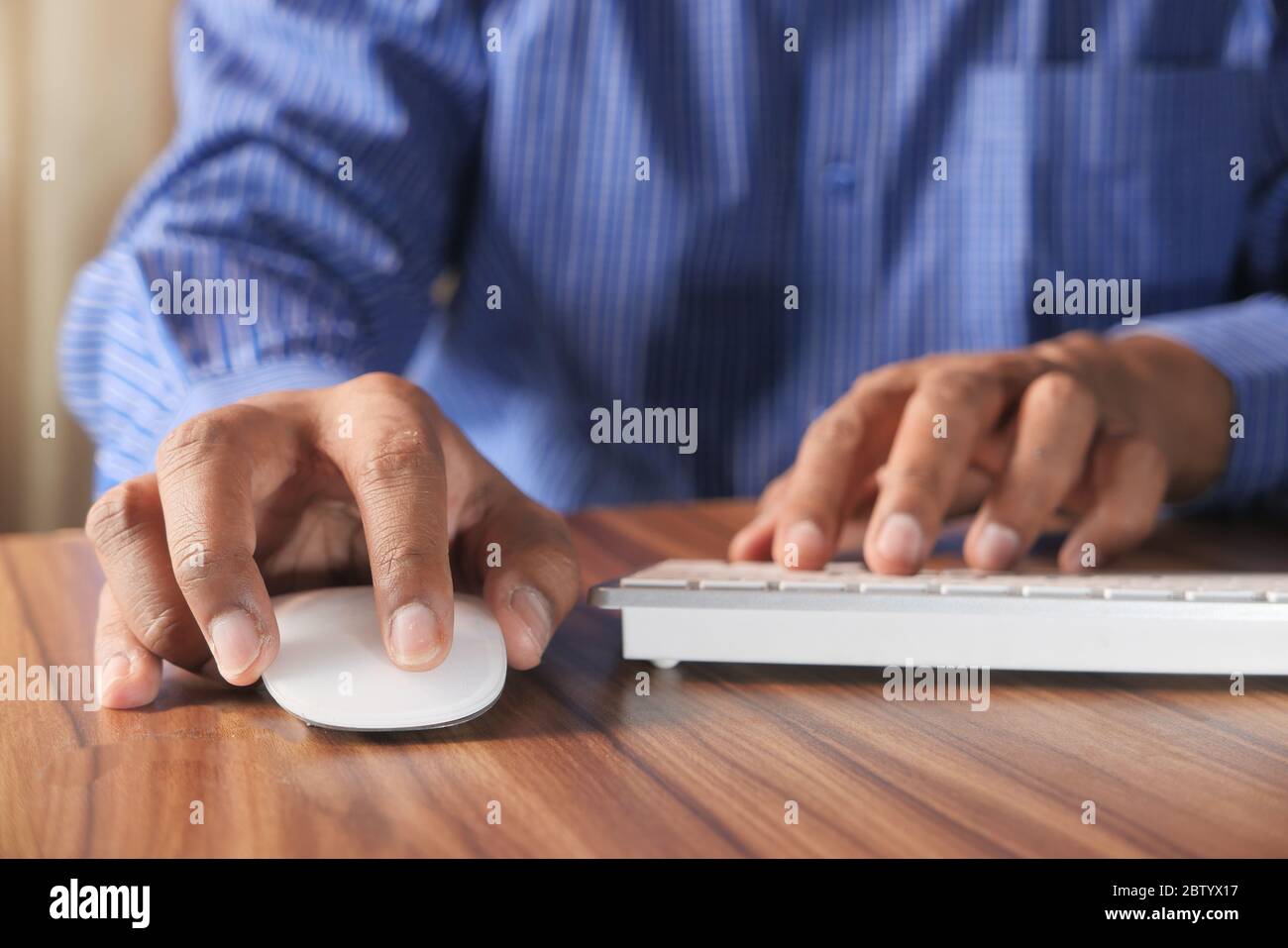 Businessman hand with computer mouse, Close up Stock Photo
